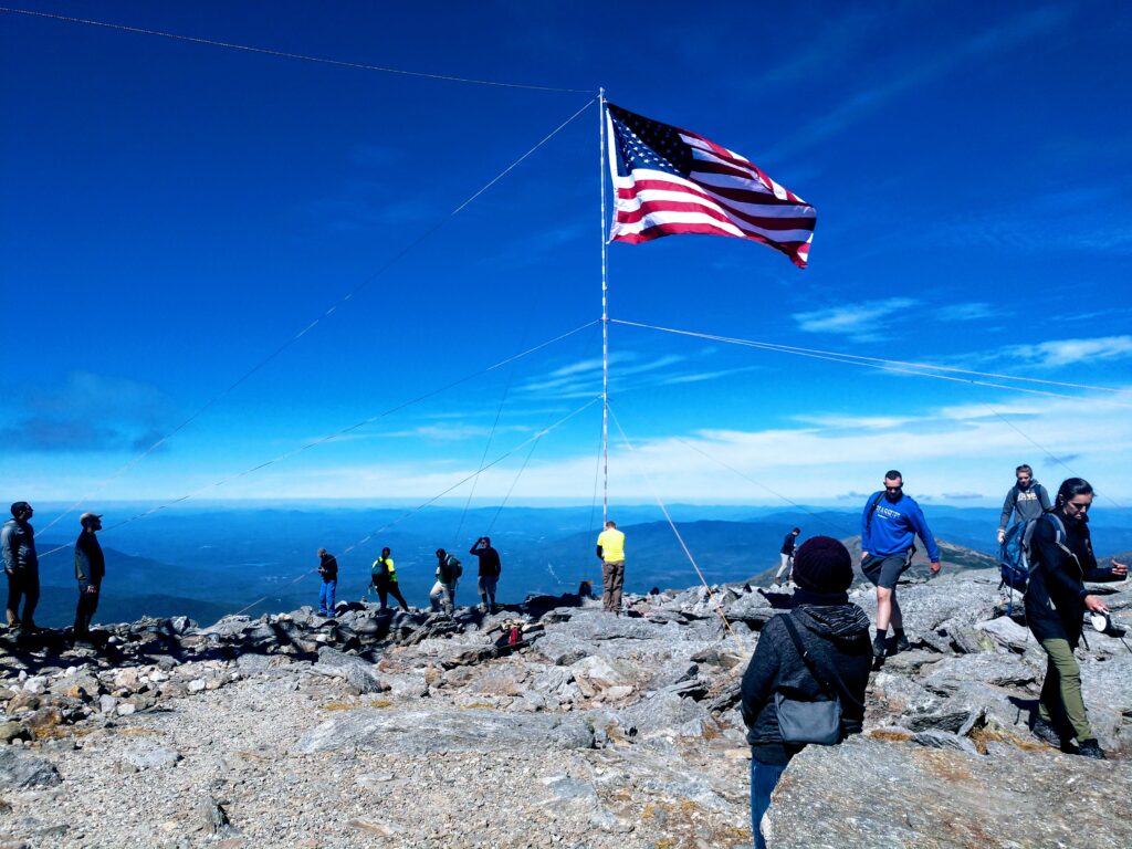 American Flag Being Raised at the Top of Mt Washington